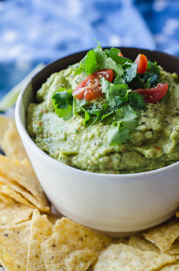 Quick & Easy Homemade Guacamole by @SoLetsHangOut is made in a food processor and only takes a couple of minutes! #guacamole #easy #cincodemayo #glutenfree #paleo 