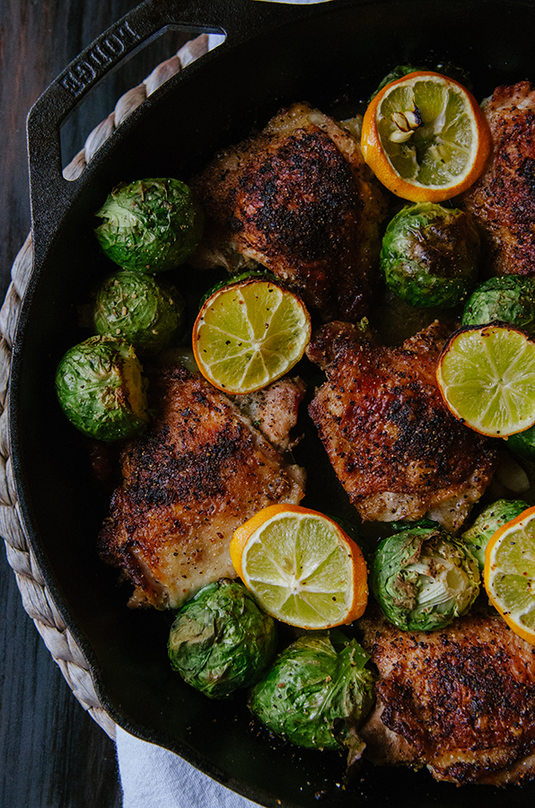 One-Skillet Crispy Lemon Pepper Chicken Thighs and Whole Roasted Brussels Sprouts by @SoLetsHangOut // #paleo #glutenfree #primal #chicken #skillet #onepan #lemonpepper #brusselssprouts 