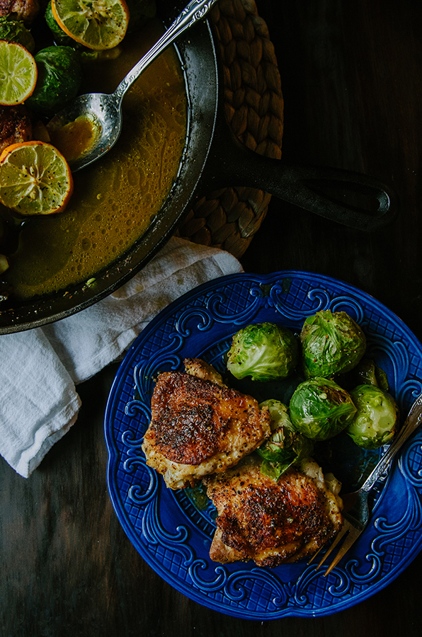 One-Skillet Crispy Lemon Pepper Chicken Thighs and Whole Roasted Brussels Sprouts by @SoLetsHangOut // #paleo #glutenfree #primal #chicken #skillet #onepan #lemonpepper #brusselssprouts 